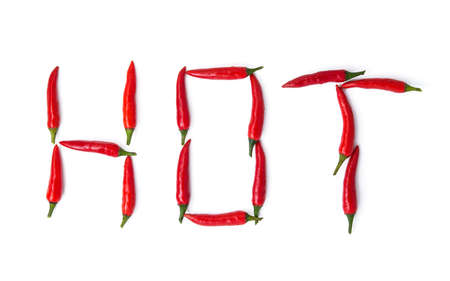 red pepper spelling the word hot isolated on white backgroundの写真素材
