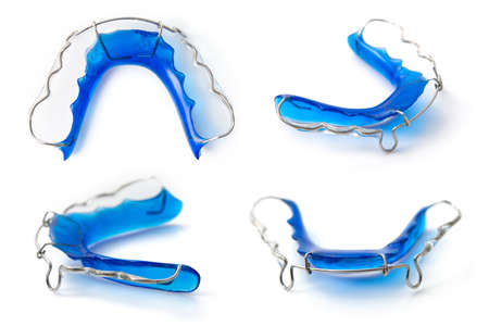 collection of retainer orthodontic equipment on white backgroundの写真素材