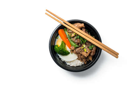 Rice with fried pork and fried egg, Japanese cuisine, isolated on white backgroundの写真素材