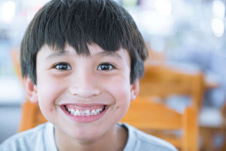 Portrait of happy joyful boy smilingの写真素材
