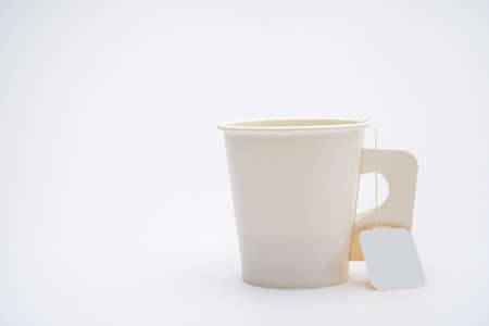 paper cup of tea isolated on whiteの写真素材