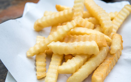potatoes fries on a white paper