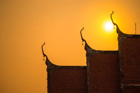 temple in thailand with sunsetの写真素材