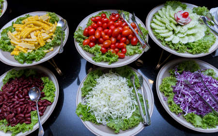 salad bar fresh vegetables with fruitの写真素材