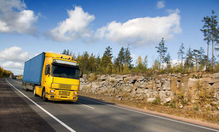 summer highway Scandinavia, trucks, rocksの写真素材