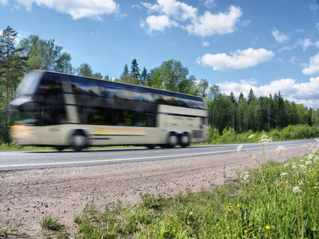 tourist bus speeding on country highway, blured in motionの写真素材