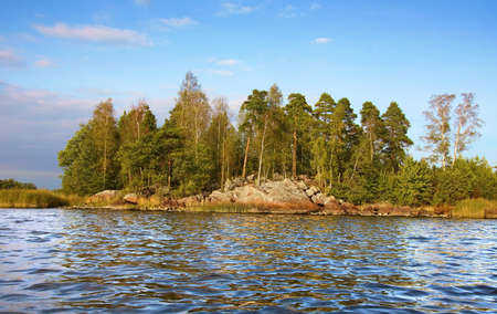 little rock island and  calm waves in Baltic sea, Vyborg bayの写真素材