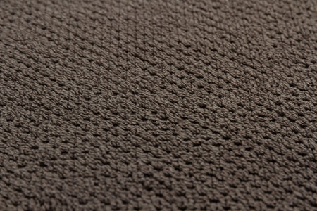 gray cotton terry towel lies on a flat surface close-up
