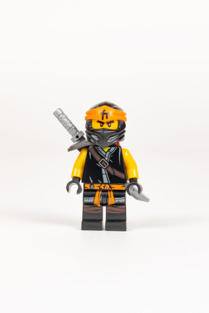 Yekaterinburg. Russia, 08/04/2021. Hero toy Cole with a sword from a set of lego ninjago on a white...