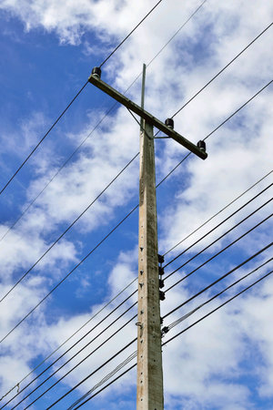Electricity post with blue sky