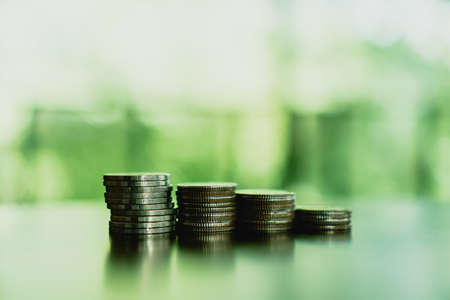 Business financial success concept with currency icon and graph double expose on picture.の写真素材
