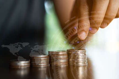 Business financial success concept with currency icon and graph double expose on picture.の写真素材