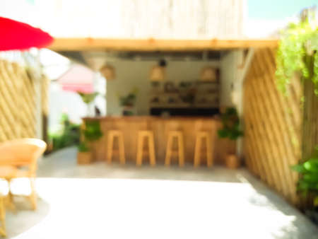 Blur coffee cafe with customers background vintage tone color style.の写真素材