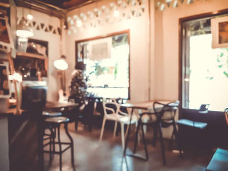 Blur coffee cafe with customers background vintage tone color style.の写真素材