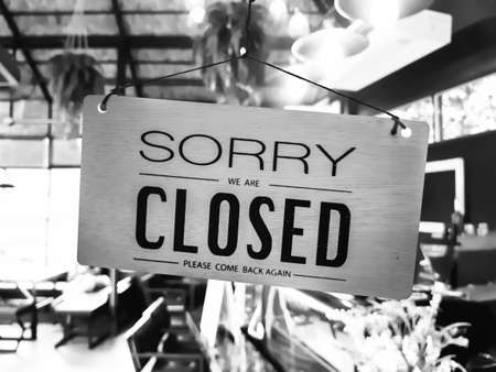 Sorry we are closed sign hang on door at coffee shop.の写真素材