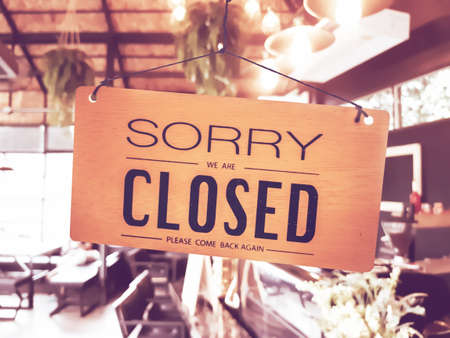 Sorry we are closed sign hang on door at coffee shop.の写真素材