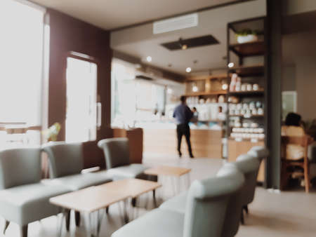 Blur coffee cafe with customers background vintage tone color style.の写真素材