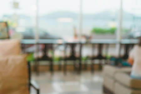 Blur coffee cafe with customers background vintage tone color style.の写真素材