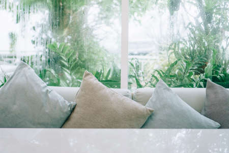 Beautiful modern living room vintage style with nature green background with grey sofa.の写真素材
