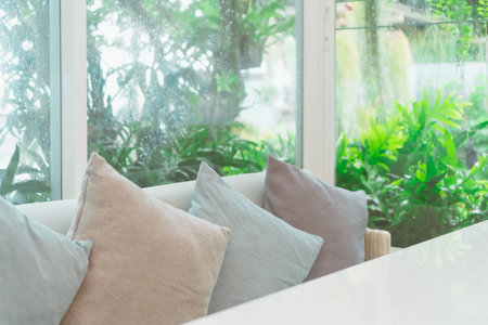 Beautiful modern living room vintage style with nature green background with grey sofa.