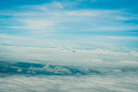 Copy space of airplane view above cloud summer blue sky and sun light abstract nature background.の写真素材