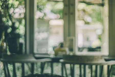 Blur coffee cafe with customers background vintage tone color style.の写真素材