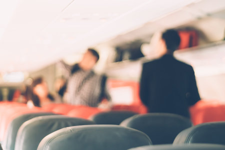 Blur inside airplane economy class and traveller travel in vacation time.