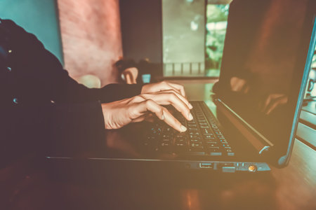 Woman hand using laptop and smartphone to work study on bed in room with nature beautiful background. Business, financial, trade stock maket and social network freedom life concept.の写真素材