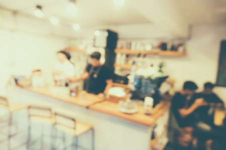 Blur coffee and restutant cafe with customers background vintage tone color style.の写真素材