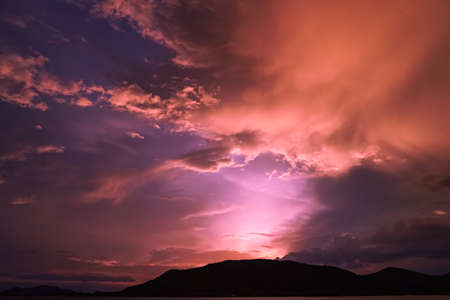 Magenta color of sunset twilight sky and cloud background.の写真素材