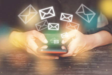 Woman hand using smartphone to send and recieve email. Business communication  technology concept.