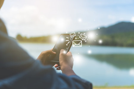 Woman hand using smartphone to send and recieve email. Business communication  technology concept.