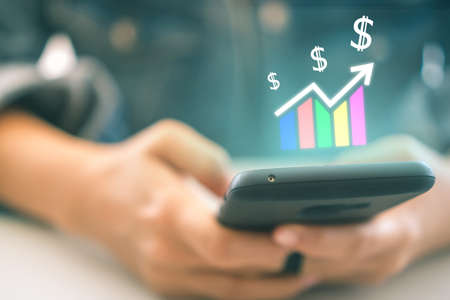 Market stock graph icon screen of smartphone background. Financial business technology freedom dream life using internet freedom life concept.の写真素材