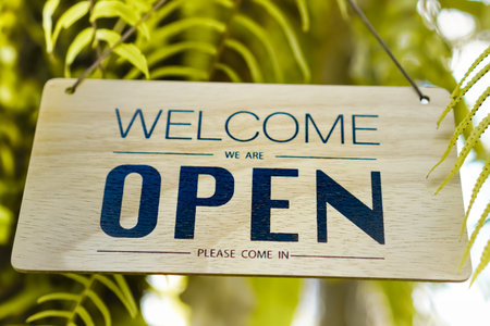 Welcome open sign use for any business in front of shop or online background.