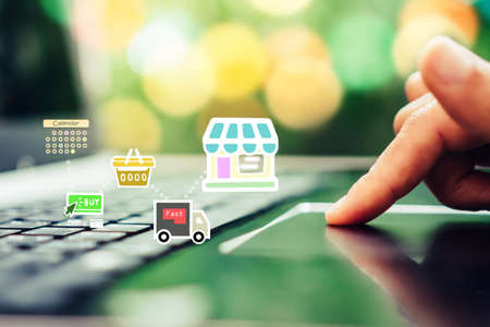 Women hand using smartphone do shopping online store with various doodle icons pop up. Social media maketing concept.の写真素材