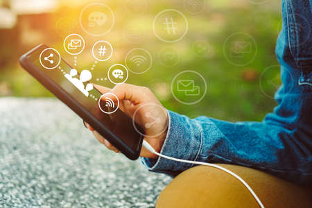 Communication fintech sign icon and connection screen of smartphone with blur cafe coffee shop background. Financial business technology freedom dream life using internet freedom life concept.の写真素材