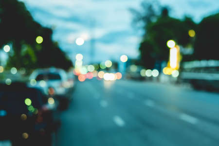 Blur traffic road with cars and other vehicle with bokeh light background.の写真素材