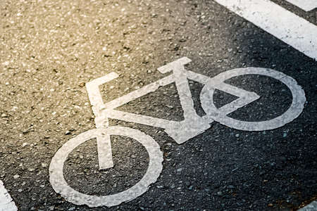 Bicycle sign on road background.の写真素材