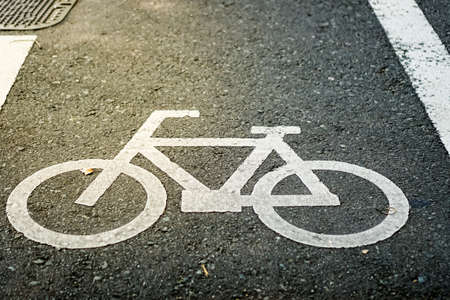 Bicycle sign on road background.の写真素材