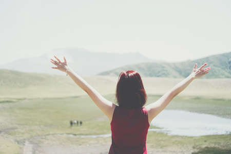 Man rise hands up to sky freedom concept with blue sky and summer field background.の写真素材