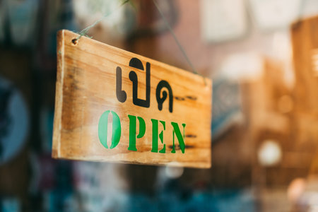 Welcome open sign on door of coffee cafe shop.の写真素材