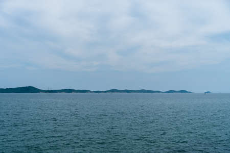 Beach with island sun light and blue sky background.の写真素材