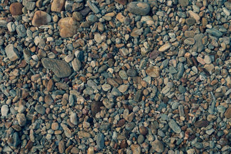 Many small stone brown color tone background texture.の写真素材