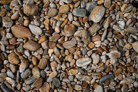 Many small stone brown color tone background texture.の写真素材
