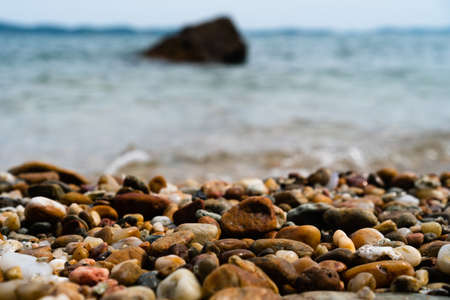 Selective focus on rocks texture with blur beach in background for display product.の写真素材
