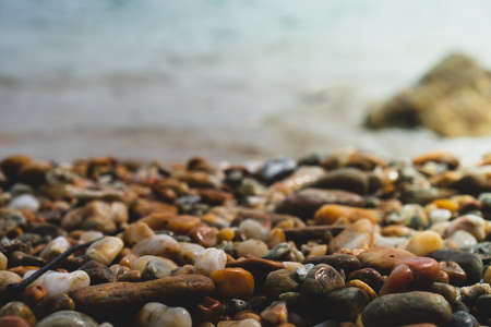 Selective focus on rocks texture with blur beach in background for display product.の写真素材