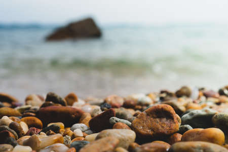 Selective focus on rocks texture with blur beach in background for display product.の写真素材
