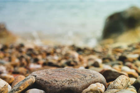 Selective focus on rocks texture with blur beach in background for display product.の写真素材