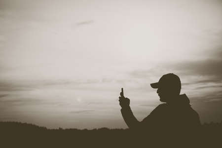 Man is trekking in mountain to take a photo scenery around nature background.の写真素材