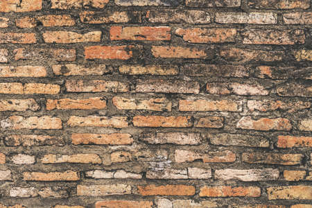 Old grunge orange brick background texture.の写真素材